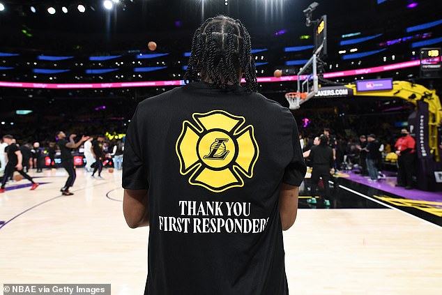 Lakers rookie Quincy Olivari wears a t-shirt dedicated to Los Angeles first responders