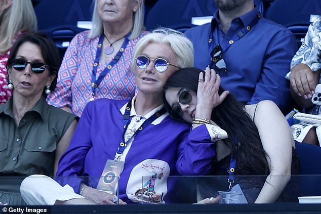 A straight-faced Ava rested her head gently on Deborra-Lee's shoulder as Mom reached out to tenderly place a hand on the side of her face