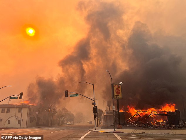 Pictured: Flames from the wind-driven Eaton Fire engulf a home in Altadena, California, January 8