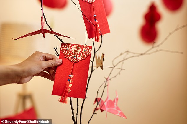 'RedNote' is associated with the color of the Chinese Communist Party, but Chinese culture reveres the color as a symbol of good luck. It is also reminiscent of the Chinese tradition of giving and receiving red envelopes containing monetary gifts and good wishes (archive photo)