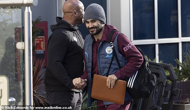 Ilkay Gundogan had a grin on his face as he was spotted outside their West London hotel