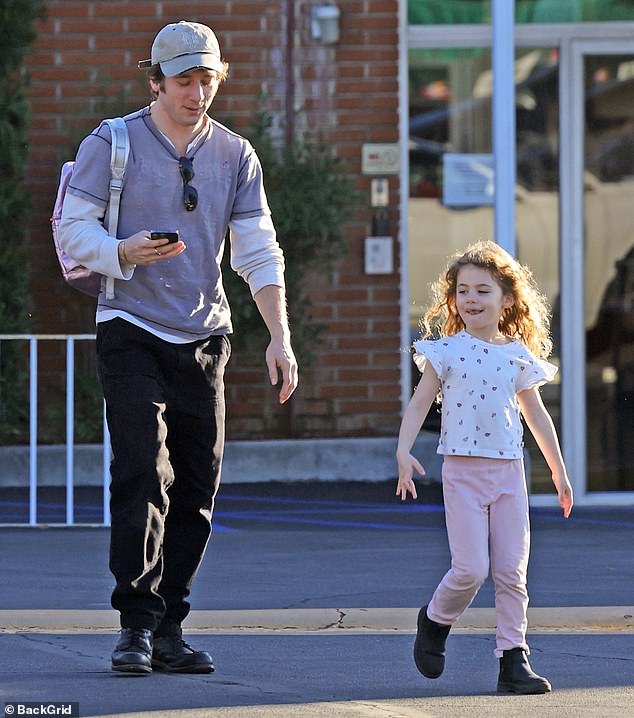 Young Ezer, six, looked adorable in a white shirt with pink hearts and pink pants. The primary school student wore black boots during the outing. White also shares daughter Dolores, four, with his ex-wife, actress Addison Timlin, 33