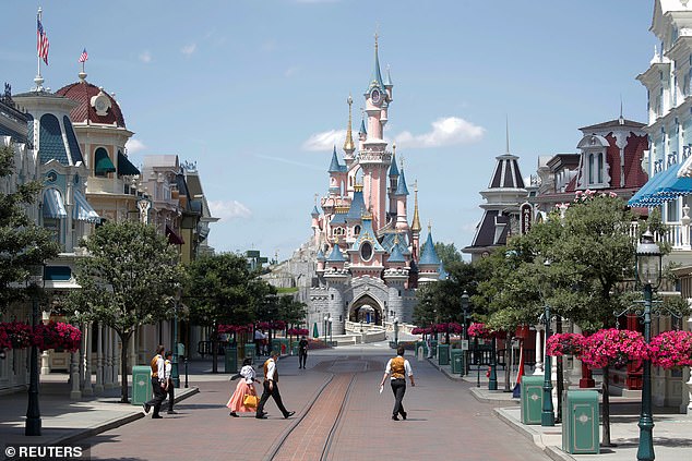 Disneyland in Anaheim, California is full of people enjoying rides like Pirates Of The Caribbean and dining on snacks like hot dogs and ice cream