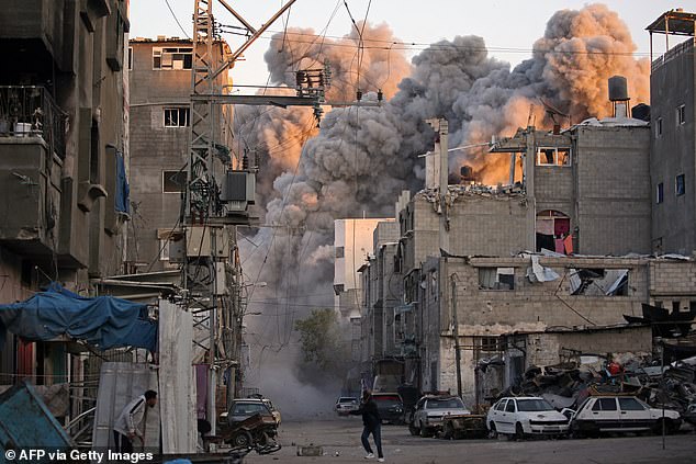 Smoke rises from a building destroyed during an Israeli airstrike on the Bureij camp for Palestinian refugees in the central Gaza Strip on January 12, 2025