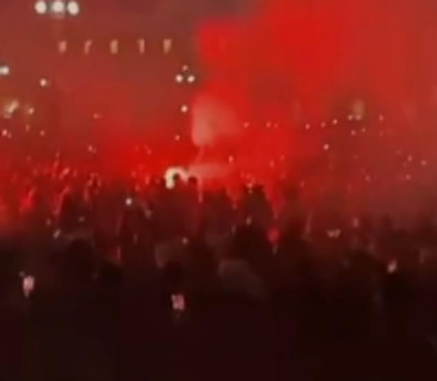 The group of students watched the fireworks in the Piazza del Duomo outside Milan Cathedral, where men wearing balaclavas were filmed causing chaotic scenes by shooting fireworks into the crowd on the same evening.