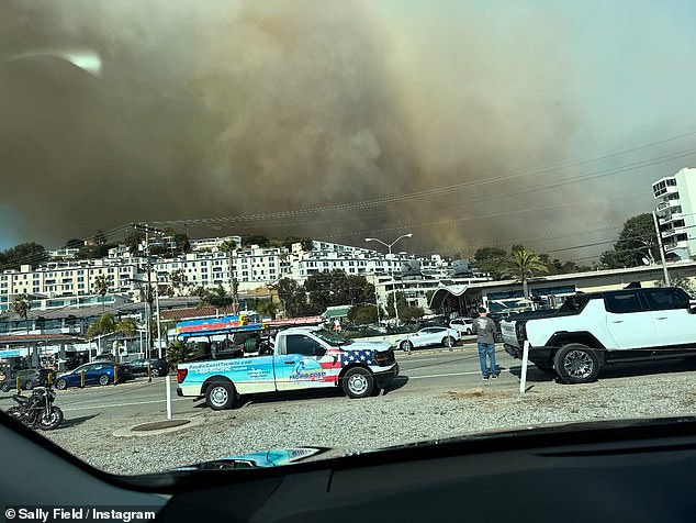 One photo shows a view of the smoke from what appeared to be the Pacific Coast Highway, which runs through Pacific Palisades and Malibu