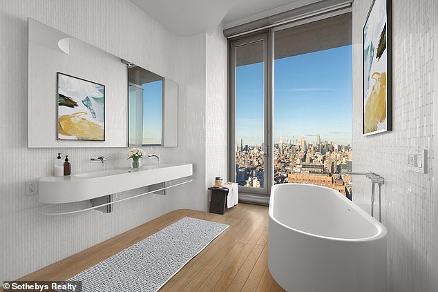 One of the bathrooms in the house with views of New York City from the floor-to-ceiling windows