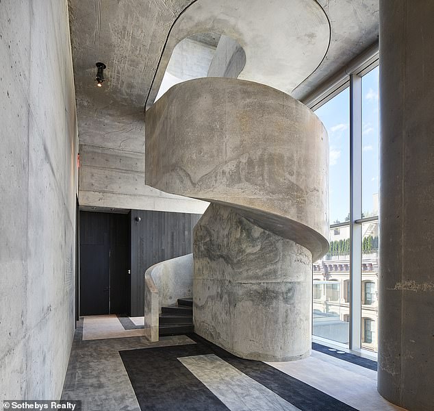 Amenities available to the building's residents include a 75-foot swimming pool, sundeck, private fitness center, residents' lounge and dining area (photo: a stairwell in the building)