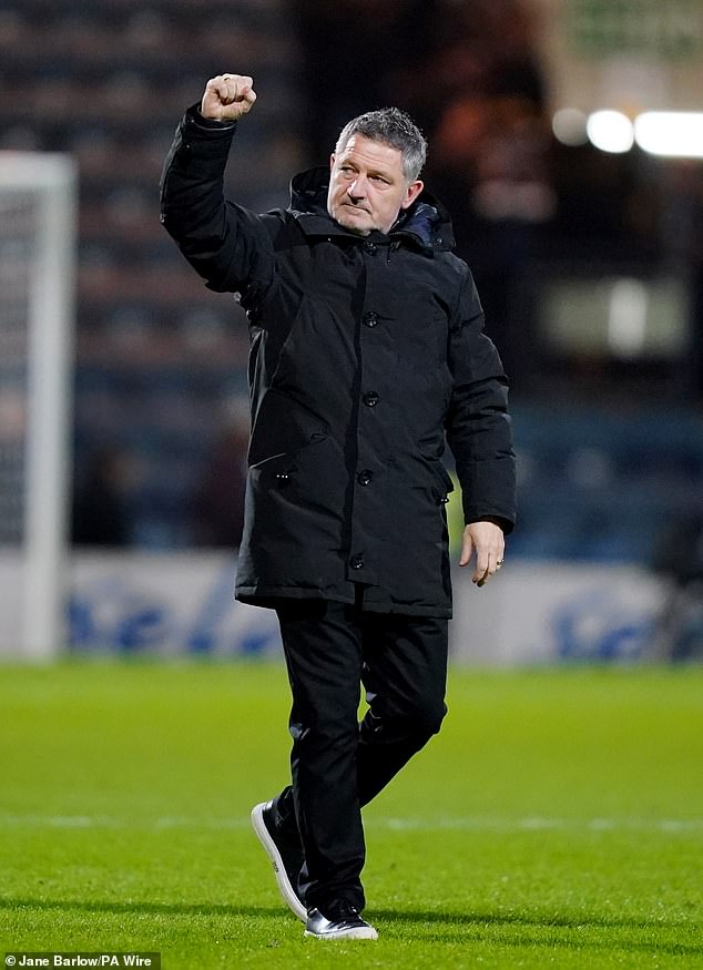 Dundee manager Tony Docherty salutes the home fans after a fine performance from his side