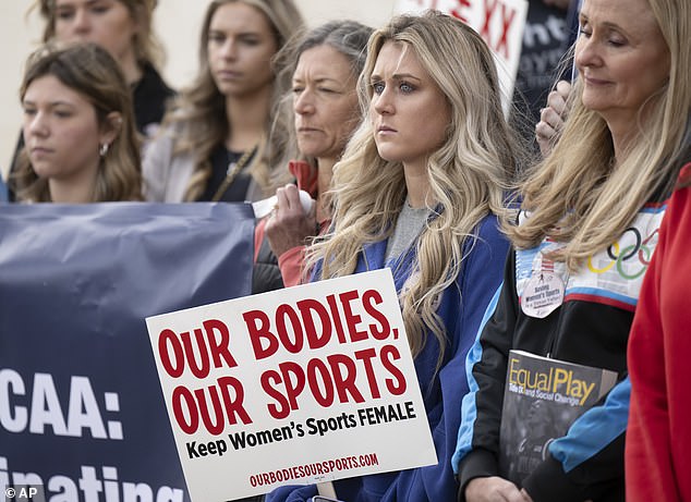 Gaines famously tied Lia Thomas — the first openly transgender athlete to win an NCAA Division I national championship — for fifth place at the NCAA Swimming and Diving Championships in March 2022. Pictured: Former University of Kentucky swimmer Riley Gaines, runner-up from right, stands during a rally