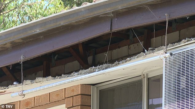 Emergency services rushed to the two-storey residential block on Myall Street in Cabramatta after the roof collapsed at 12.30pm on Wednesday (damage to the building is pictured)