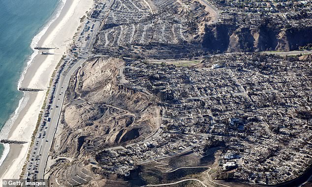 Zuckerman, unlike other companies that have stopped writing policies or refused to renew customers amid the raging fires, believes the state and its wildfires are still insurable. Pictured: An aerial view of fire trucks, utility vehicles and other vehicles parked along the Pacific Coast Highway near homes destroyed by the Palisades Fire