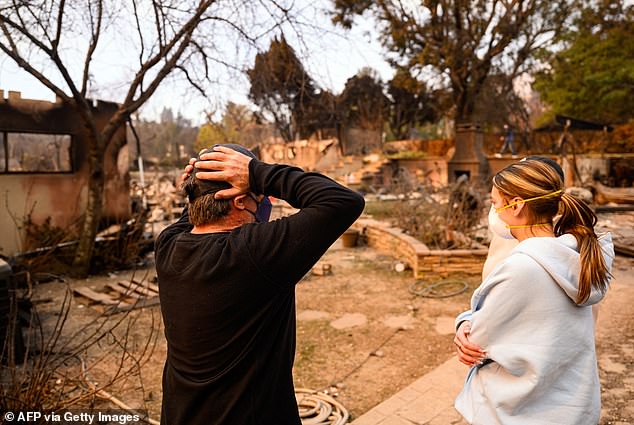 Lubeley reacts as he arrives at his burned home during the Eaton fire in the Altadena area of ​​Los Angeles County