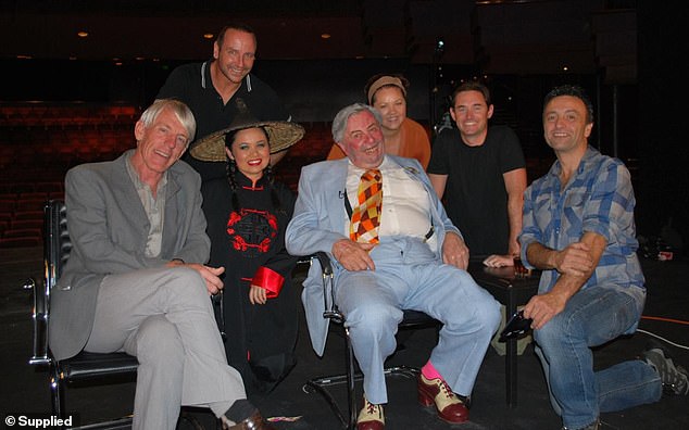 Late Sunday Night soundo Sam Beattie (second from right) during an interview with comedian Barry Humphries