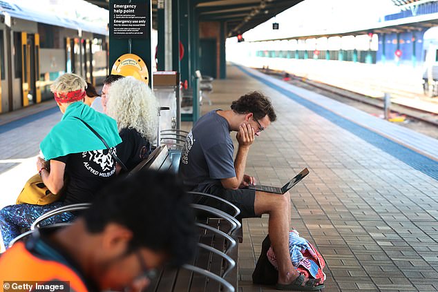 Commuters wait at Sydney Central Station on Wednesday after strike action plunged the network into chaos