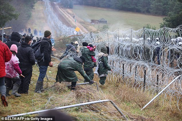 Migrants near the Polish border. Poland said hundreds of people were being transferred from Belarus as a deliberate tactic to burden the border