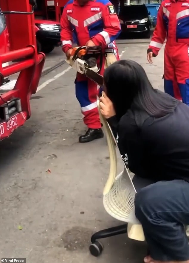 The firefighters at one point pulled out a chainsaw while teasing the woman