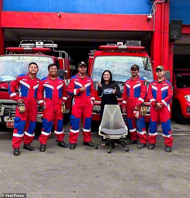 The woman happily posed with her rescuers - and the pesky chair and nose ring - after the ordeal