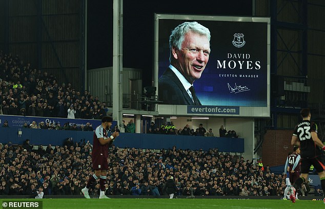 An image of his face was shown on a large screen as he prepared for his 519th match in charge