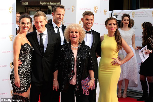 (L-R) Hollyoaks stars Jennifer Metcalfe, James Sutton, Jeremy Sheffield, Diane Langton, Keiron Richardson and Nikki Sanderson at the 2015 BAFTA Television Awards