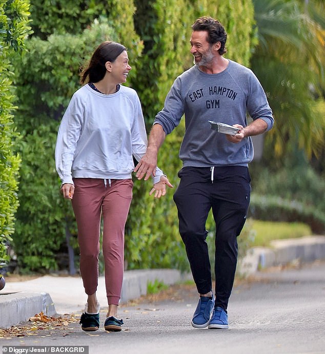 Jackman looked giddy as he gave Foster the look of love while dressed in a gray sweater, sweatpants and sneakers