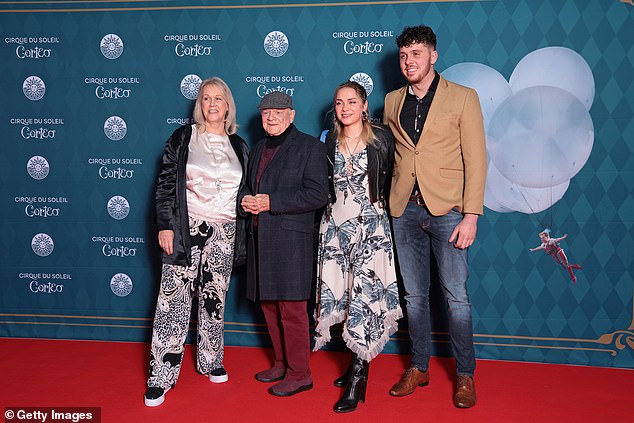 The actor's wife Gill stood out in black and white patterned trousers and a satin top, while daughter Sophie wore a butterfly motif dress.