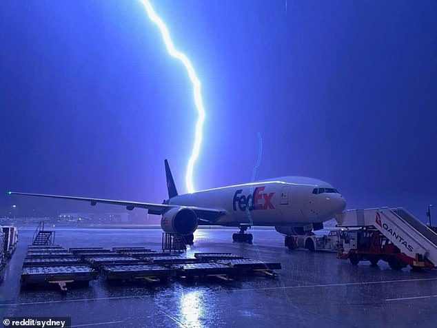 More than 200,000 homes in Sydney, Newcastle and Wollongong were left without power after lightning strikes. Pictured: Lightning at Sydney Airport