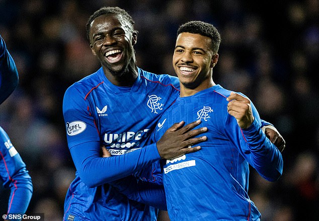 Nsiala congratulates Igamane after his 13th minute goal at Ibrox