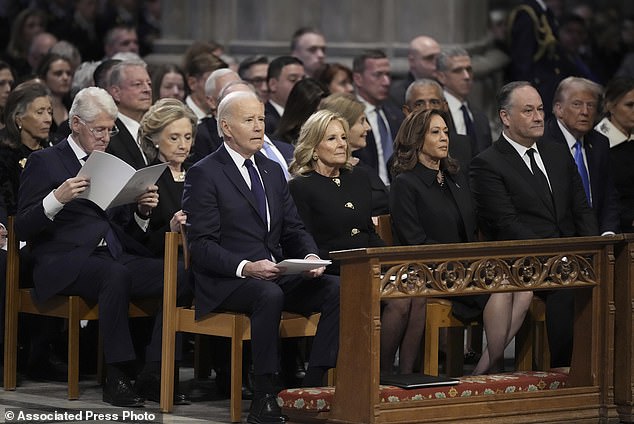 Michelle Obama was the only spouse absent from President Jimmy Carter's funeral on Thursday. President Joe Biden, first lady Jill Biden, Vice President Kamala Harris, second gentleman Doug Emhoff, former President Bill Clinton, former first lady Hillary Clinton, former President George W. Bush, former first lady Laura Bush, former President Barack Obama, former President and President-elect Donald Trump, former first lady Melania Trump, former Vice President Al Gore and former Vice President Mike Pence were all in attendance