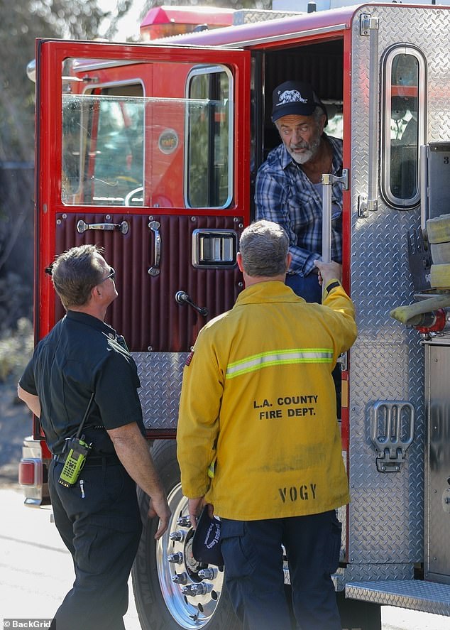 The Oscar-winning actor was escorted through the neighborhood in a fire truck and then walked the grounds where his $14.5 million home once stood