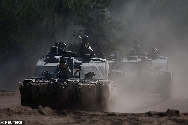 British Army soldiers ride Challenger 2 tanks during Exercise Immediate Response as part of NATO's Exercise Steadfast Defender 2024, in Poland, May 15, 2024