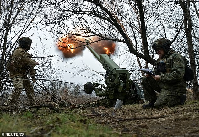 Ukrainian soldiers fire a D-30 howitzer at Russian troops at a frontline position, amid the Russian attack on Ukraine, in the Zaporizhia region, Ukraine, January 11, 2025