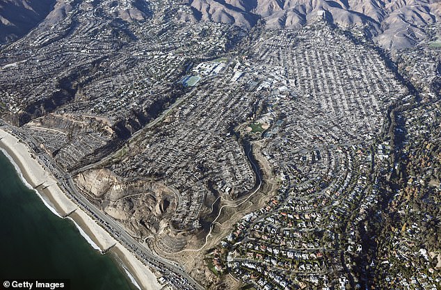 An aerial view of homes destroyed by the Palisades Fire. More than 12,000 structures have been burned in the fires that continue to ravage LA