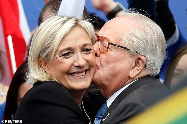 Jean-Marie Le Pen, founder of the French political party Front National, embraces his daughter Marine Le Pen in 2013