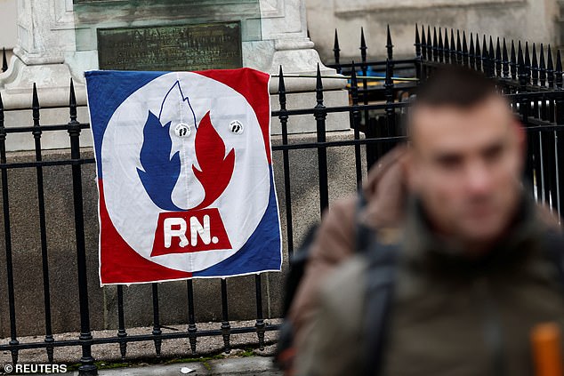 A flag of the French far-right party National Rally (Rassemblement National - RN) hangs near the Notre-Dame du Val-de-Grace church