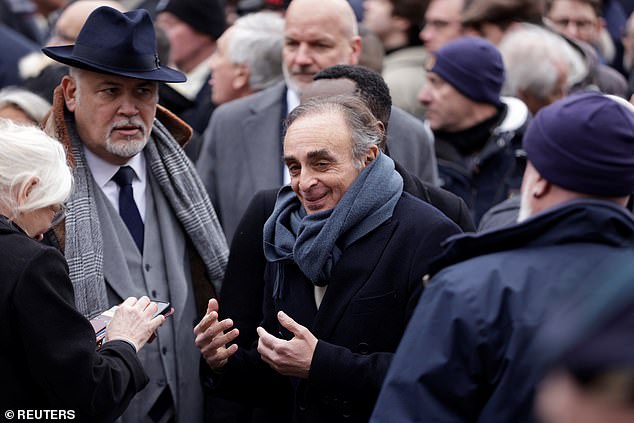 Eric Zemmour leaves after a religious ceremony to pay tribute to Jean-Marie Le Pen