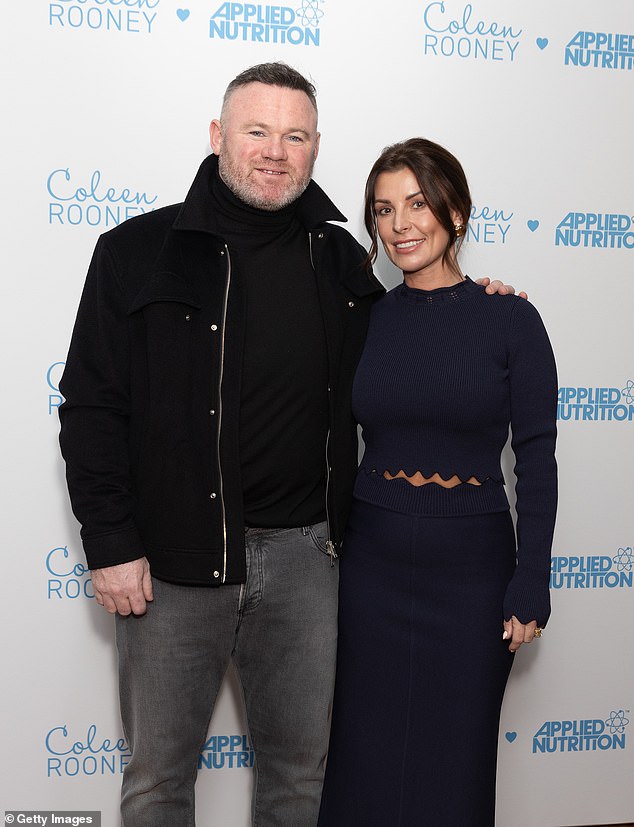 Coleen beamed as she arrived for the launch of the Coleen Rooney x Applied Nutrition range, with husband Wayne by her side