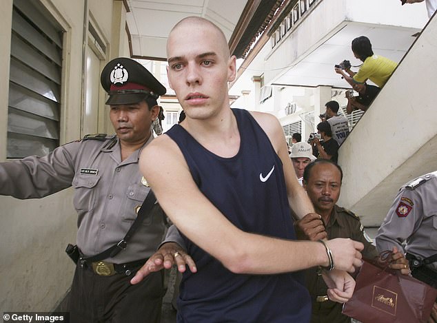 Norman, the youngest member of the Bali Nine, was only 18 years old when he was arrested. In the photo he is accompanied to his sentencing trial in Bali in 2006