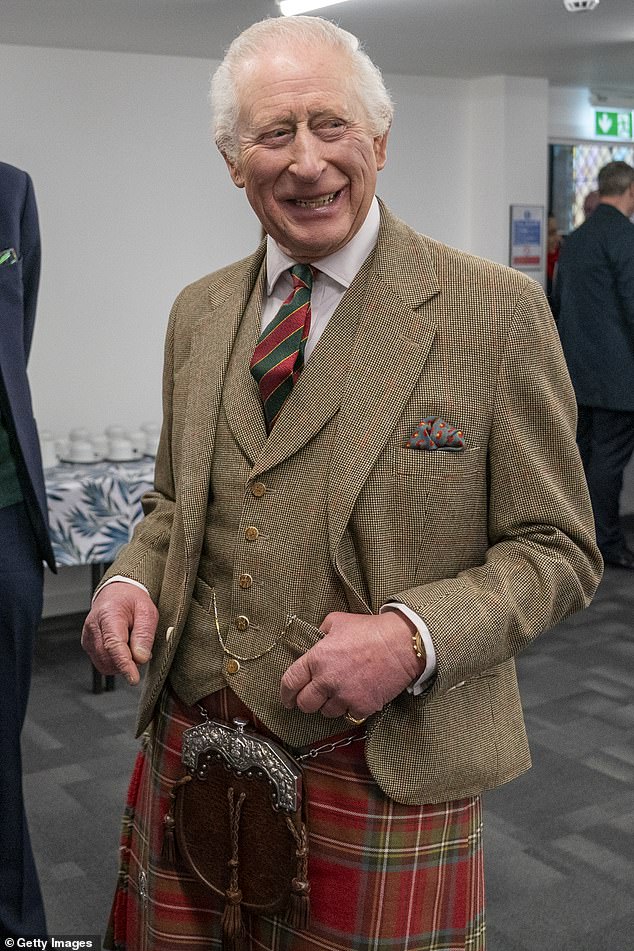 Charles looked dapper in his red and green tartan kilt, which he teamed with a beige tweed blazer, matching waistcoat, crisp white shirt and an emerald and ruby ​​striped tie