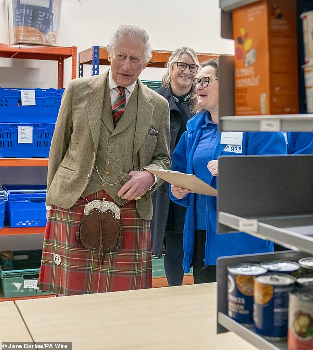 Charles then headed to the Gate food bank area, where volunteers explained to him how the bank works