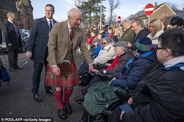 Crowds formed outside the organisation's building, with many cheerful royalists hoping to catch a glimpse of Charles as he visited the charity.