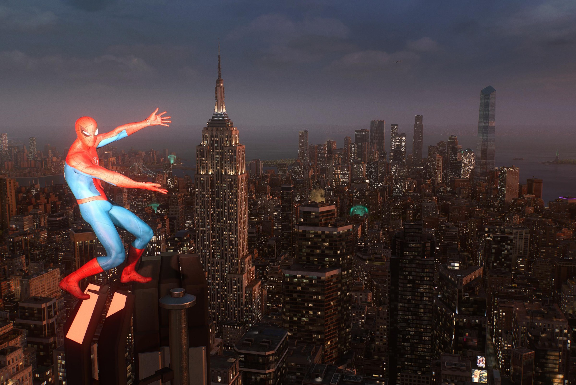 Spider-Man stands atop a skyscraper, presenting the view of New York City at dusk with his arms outstretched. Spider-Man 2 is a beautiful game!