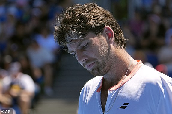 Cameron Norrie of Great Britain reacts during his first round loss to Matteo Berrettini of Italy at the Australian Open tennis championship in Melbourne, Australia, Tuesday, Jan. 14, 2025. (AP Photo/Asanka Brendon Ratnayake)