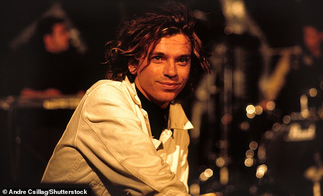 Never Tear Us Apart, released as a single in 1988, contains lyrics inspired by Australian film and television producer Michele Bennett, then girlfriend of frontman Michael Hutchence (pictured).