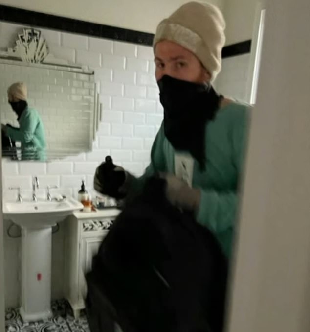 The homeowner claimed that the intruder (pictured in the bathroom) asked her to stop filming