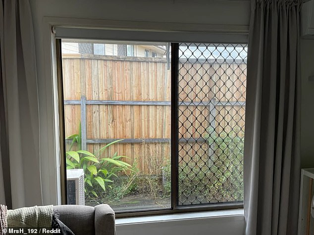 The resident said the new fence blocks natural light into their home (photo)