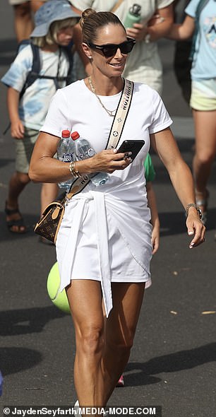 She embraced tennis chic fashion while feeling comfortable in a pair of white sneakers