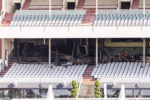 The wooden floor in the old stand caused the fire to spread quickly, resulting in 'millions' in damage (photo)