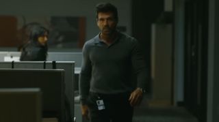 Frank Grillo's Rick Flag Sr walks through an office in Peacemaker season 2