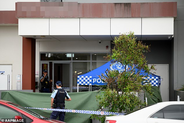 The nurse's body discovered in a garden bed at the complex. In the photo the police are on the scene